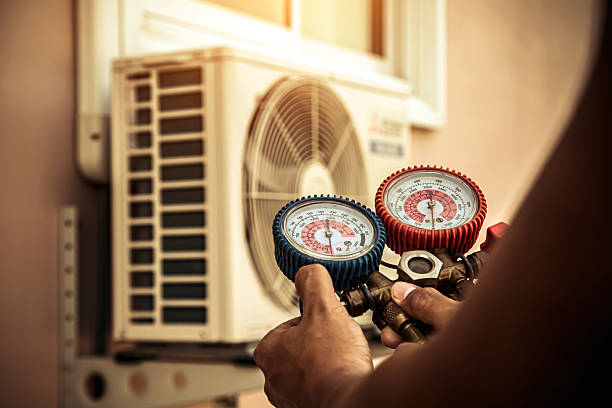 Professional Air Conditioning Service technician working in East Berne, NY
